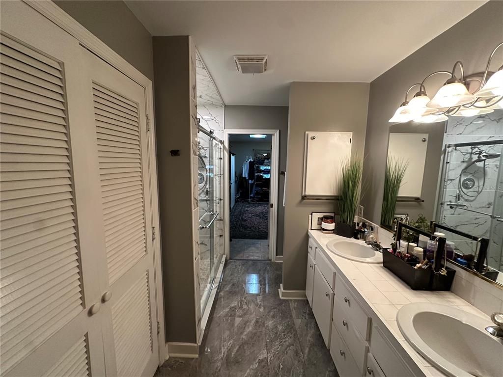 Bathroom, Dual Sink Vanities, Glass Shower, Interior, Marble, Marble Walls, Tile Countertops