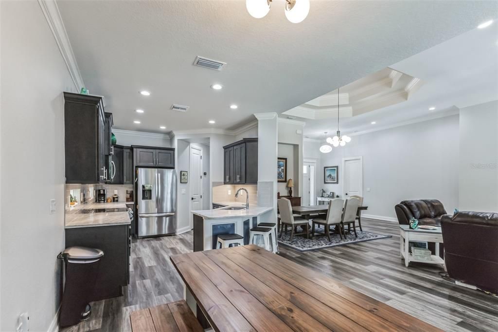 Dining room, Interior, Kitchen, Living room, Pendant Lights, Recessed Lighting, Stainless Steel Appliances, Wood Texture Flooring