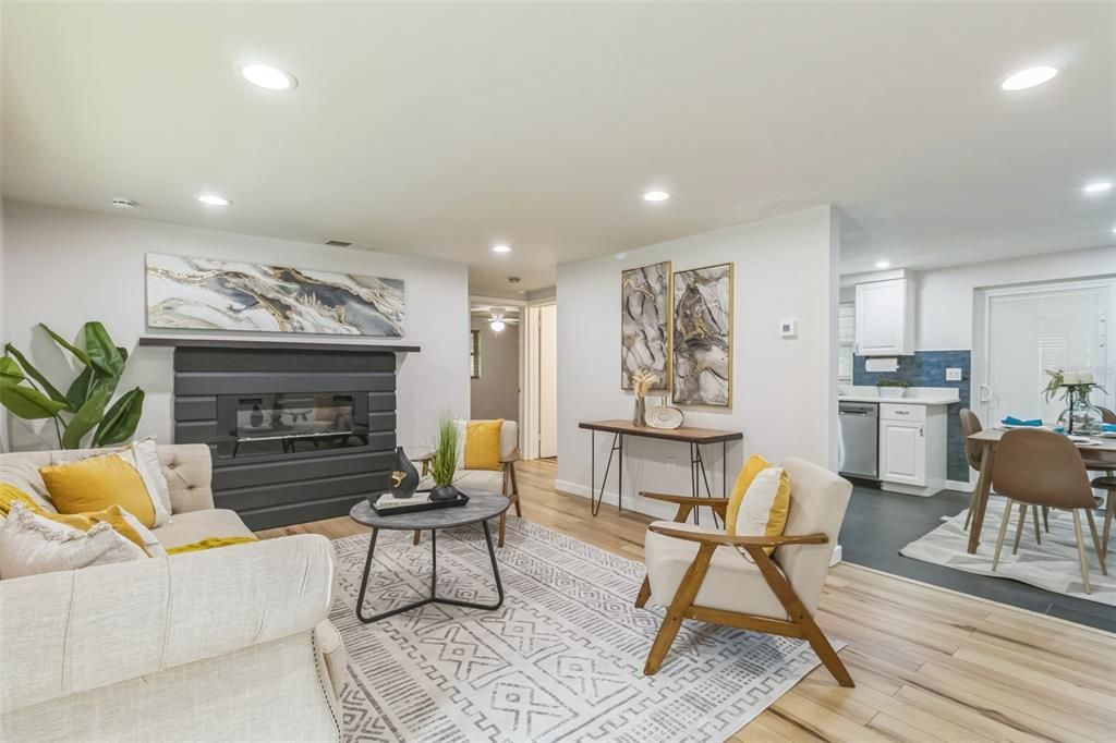 Dining room, Fireplace, Interior, Living room, Recessed Lighting, Wood Texture Flooring