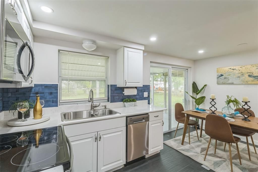 Dining room, Interior, Kitchen, Recessed Lighting, Stainless Steel Appliances, Wood Texture Flooring