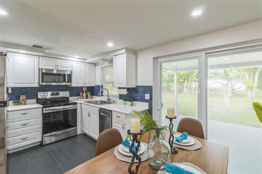 Dining room, Interior, Kitchen, Recessed Lighting, Stainless Steel Appliances, Wood Texture Flooring