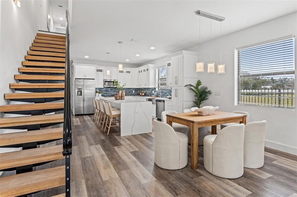 Dining room, Interior, Kitchen, Pendant Lights, Recessed Lighting, Stainless Steel Appliances, Wood Texture Flooring