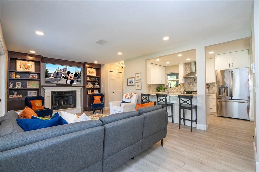 Fireplace, Interior, Kitchen, Living room, Recessed Lighting, Stainless Steel Appliances, Wood Texture Flooring