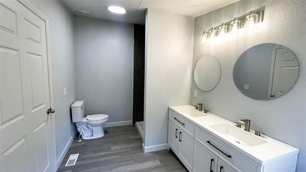 Bathroom, Dual Sink Vanities, Interior, Recessed Lighting, Wood Texture Flooring