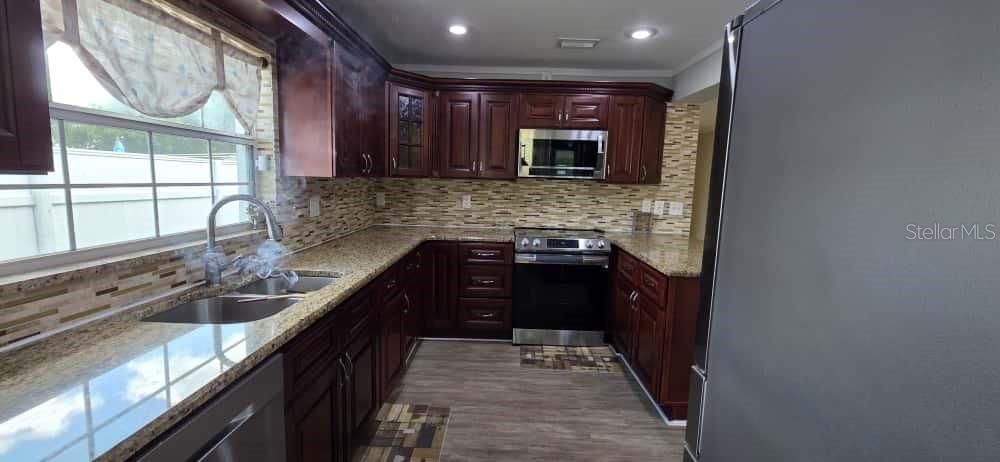 Interior, Kitchen, Recessed Lighting, Stainless Steel Appliances, Wood Texture Flooring