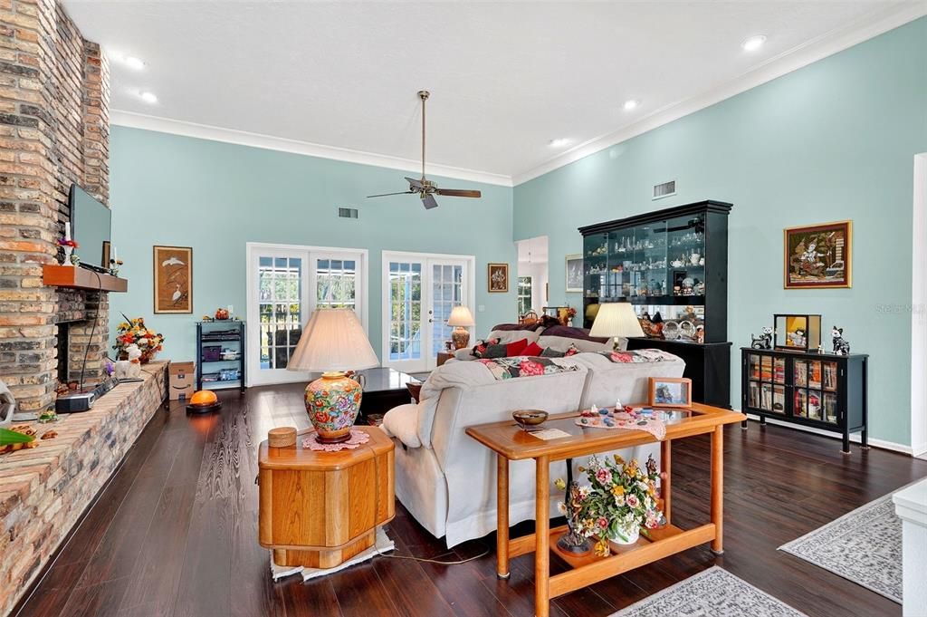 Fireplace, Interior, Living room, Recessed Lighting, Stone Walls, Wood Texture Flooring