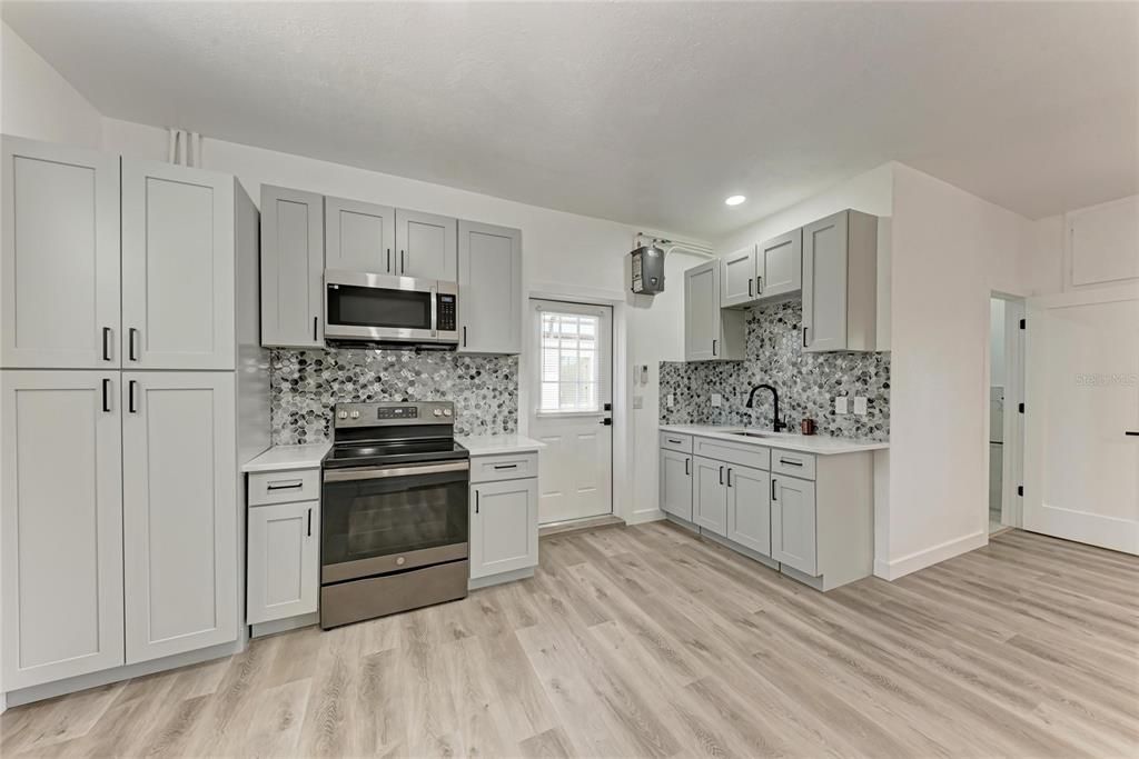 Interior, Kitchen, Recessed Lighting, Stainless Steel Appliances, Wood Texture Flooring