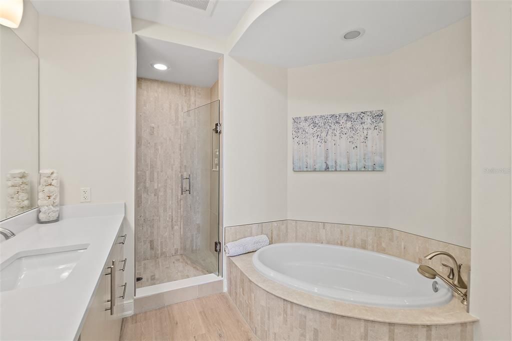 Bathroom, Dual Sink Vanities, Glass Shower, Interior, Recessed Lighting, Wood Texture Flooring