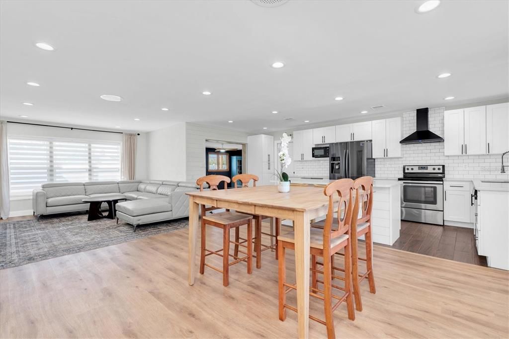 Dining room, Interior, Kitchen, Living room, Recessed Lighting, Stainless Steel Appliances, Wood Texture Flooring