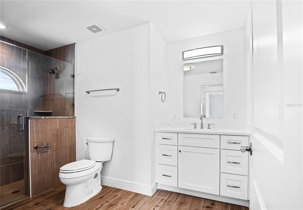 Bathroom, Glass Shower, Interior, Recessed Lighting, Wood Texture Flooring