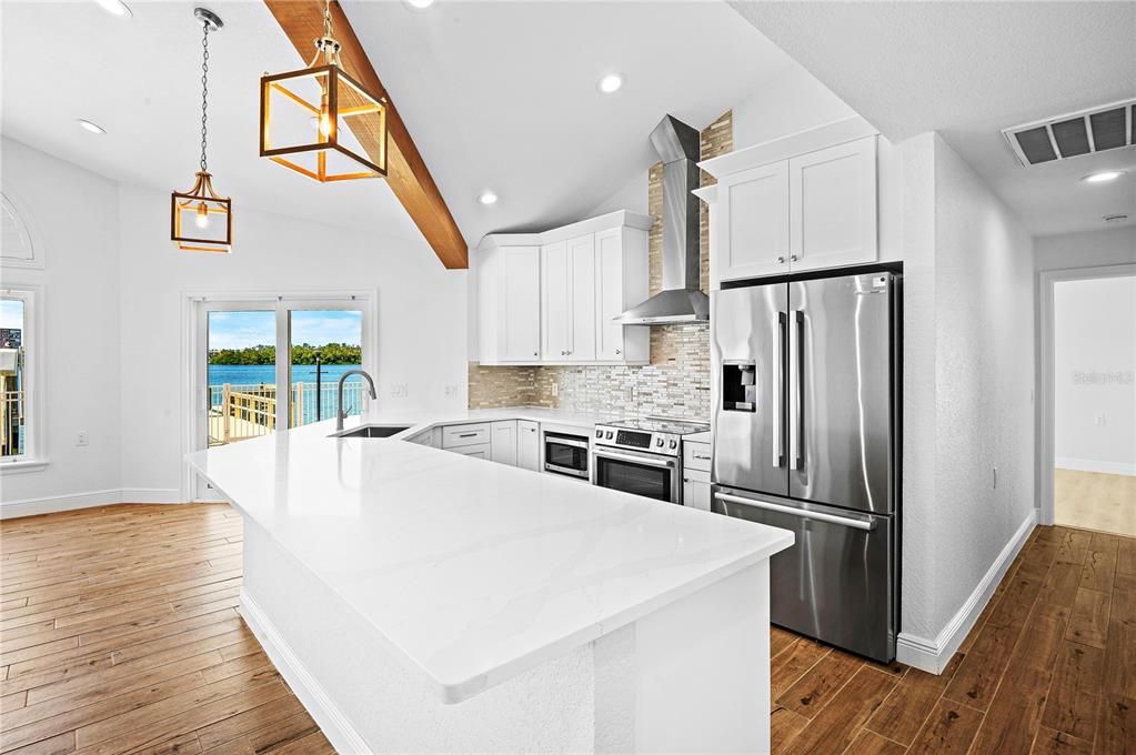 Interior, Kitchen, Pendant Lights, Recessed Lighting, Stainless Steel Appliances, Water, Wooden Beams, Wood Texture Flooring