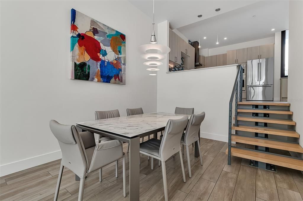 Dining room, Interior, Kitchen, Pendant Lights, Recessed Lighting, Stainless Steel Appliances, Wood Texture Flooring