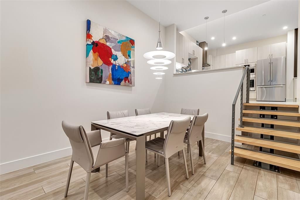 Dining room, Interior, Kitchen, Pendant Lights, Recessed Lighting, Stainless Steel Appliances, Wood Texture Flooring