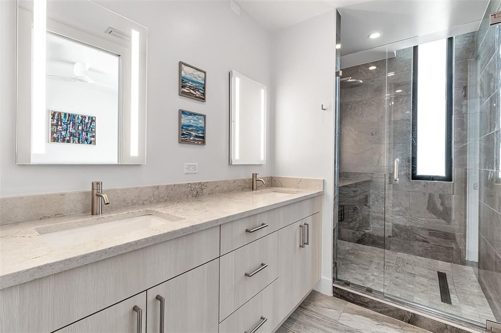 Bathroom, Dual Sink Vanities, Glass Shower, Interior, Marble Walls, Recessed Lighting