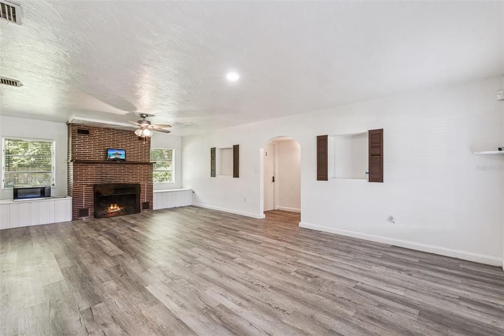 Empty room, Fireplace, Interior, Recessed Lighting, Stone Walls, Wood Texture Flooring