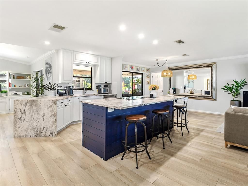 Interior, Kitchen, Marble Walls, Pendant Lights, Recessed Lighting, Stainless Steel Appliances, Wood Texture Flooring