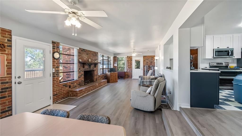 Fireplace, Interior, Kitchen, Stainless Steel Appliances, Stone Walls, Wood Texture Flooring