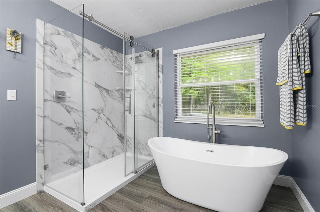 Bathroom, Free Standing Baths, Glass Shower, Interior, Marble Walls, Wood Texture Flooring