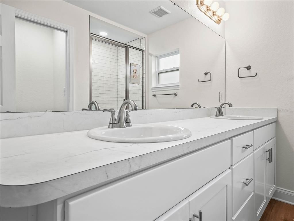 Bathroom, Dual Sink Vanities, Interior, Recessed Lighting, Wood Texture Flooring