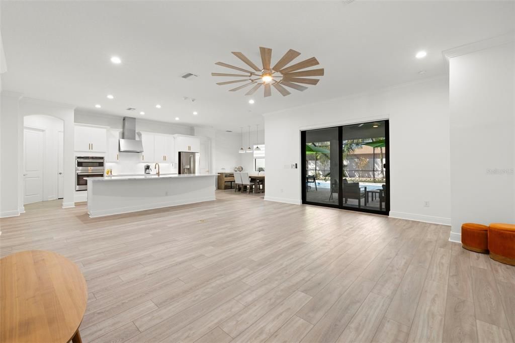 Dining room, Interior, Kitchen, Pendant Lights, Recessed Lighting, Stainless Steel Appliances, Wood Texture Flooring