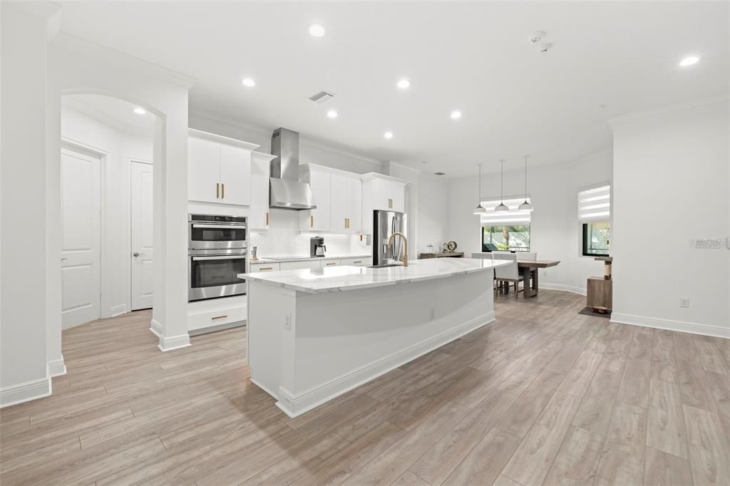Dining room, Interior, Kitchen, Pendant Lights, Recessed Lighting, Stainless Steel Appliances, Wood Texture Flooring