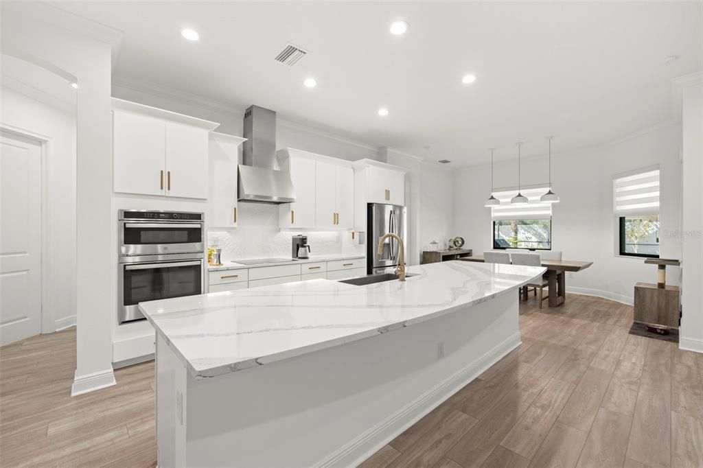 Dining room, Interior, Kitchen, Pendant Lights, Recessed Lighting, Stainless Steel Appliances, Wood Texture Flooring