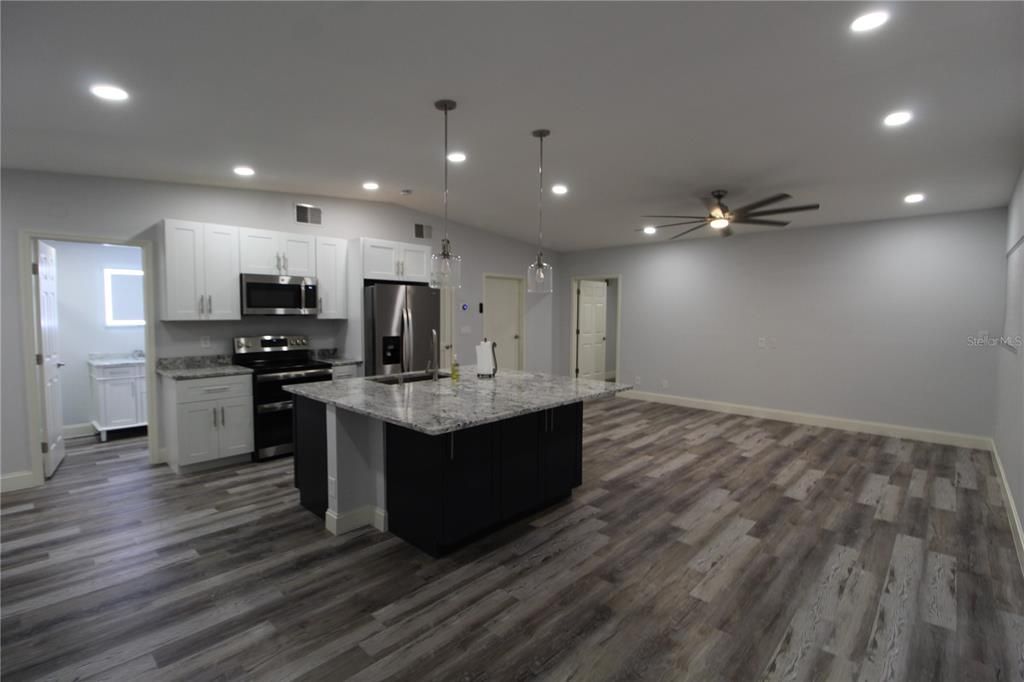 Interior, Kitchen, Pendant Lights, Recessed Lighting, Stainless Steel Appliances, Wood Texture Flooring