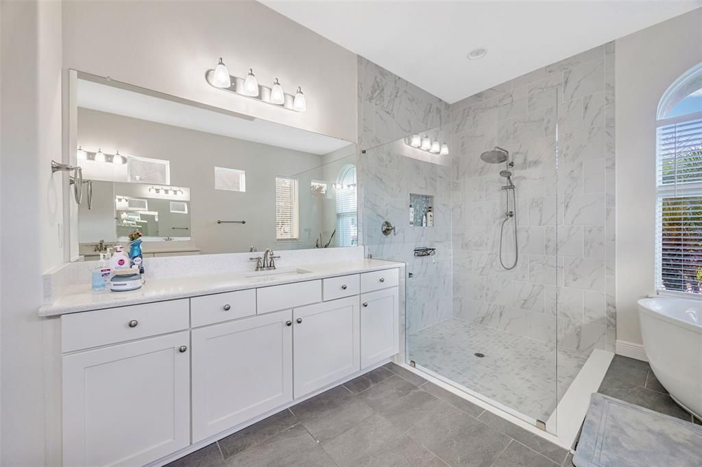 Bathroom, Dual Sink Vanities, Free Standing Baths, Glass Shower, Interior, Marble Walls, Recessed Lighting