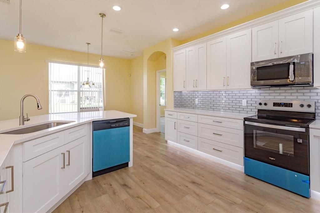 Interior, Kitchen, Pendant Lights, Recessed Lighting, Stainless Steel Appliances, Wood Texture Flooring
