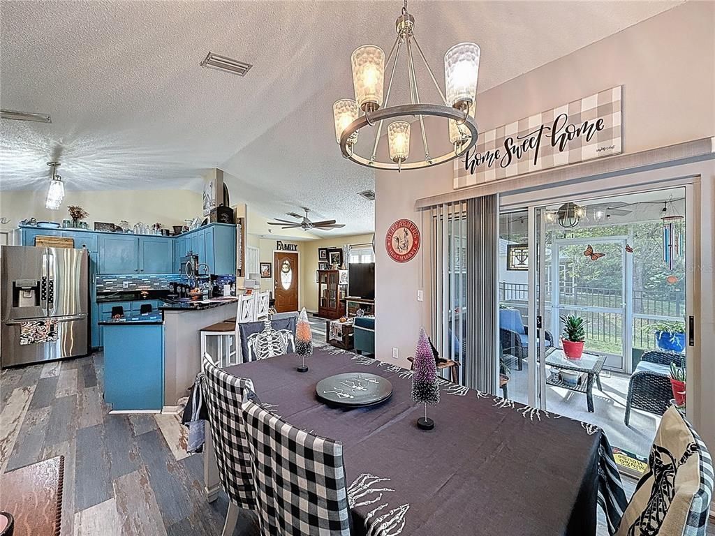 Chandelier, Dining room, Interior, Kitchen, Pendant Lights, Stainless Steel Appliances, Wood Texture Flooring