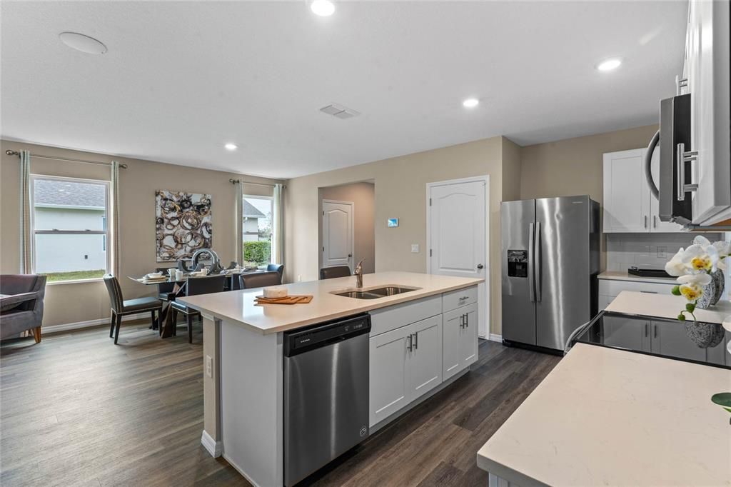 Dining room, Interior, Kitchen, Recessed Lighting, Stainless Steel Appliances, Wood Texture Flooring