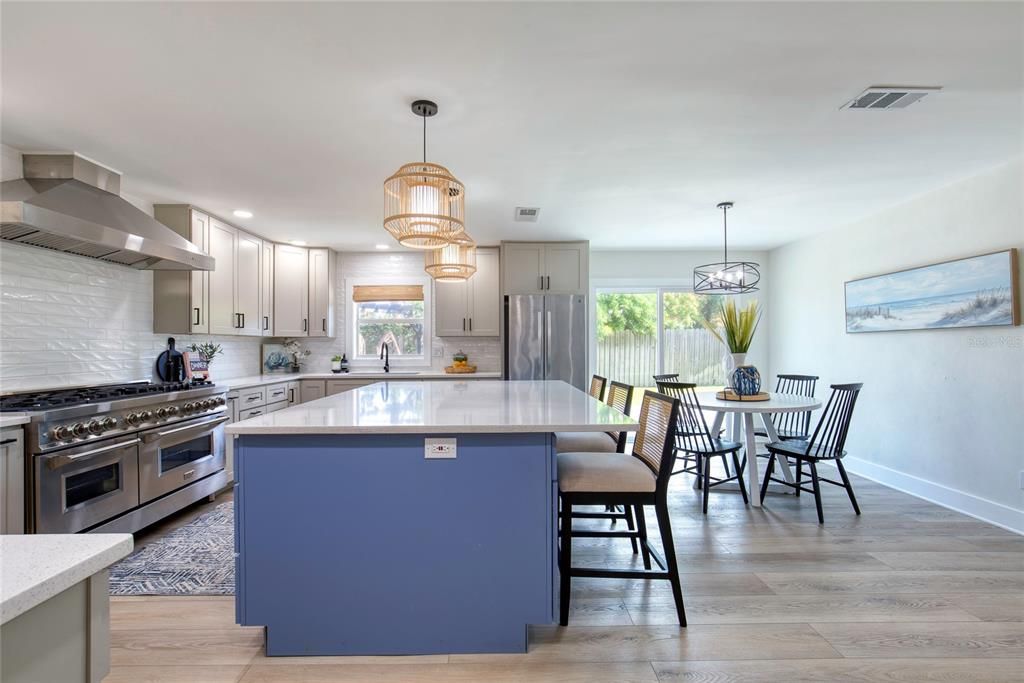 Dining room, Interior, Kitchen, Pendant Lights, Recessed Lighting, Stainless Steel Appliances, Wood Texture Flooring