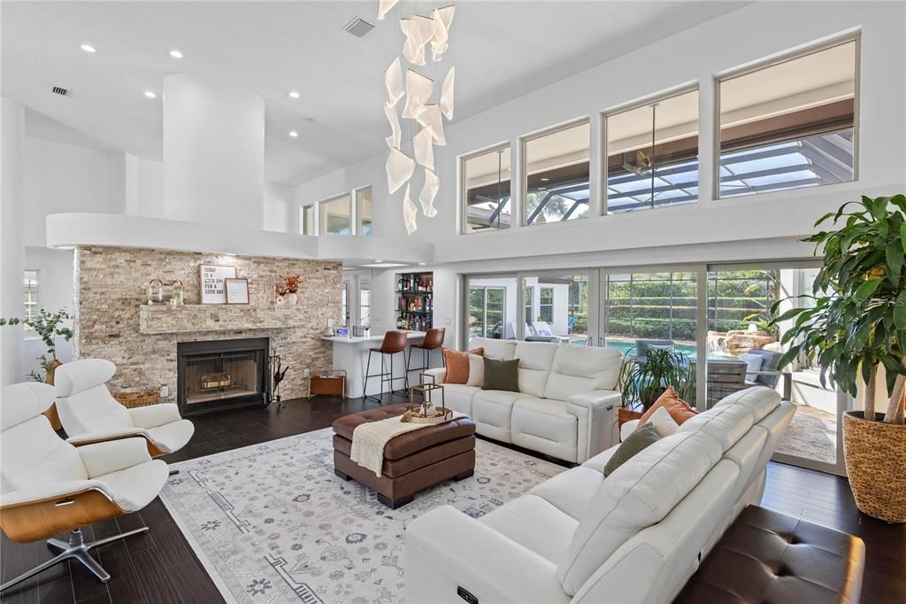 Fireplace, Interior, Living room, Pendant Lights, Recessed Lighting, Stone Walls, Wood Texture Flooring