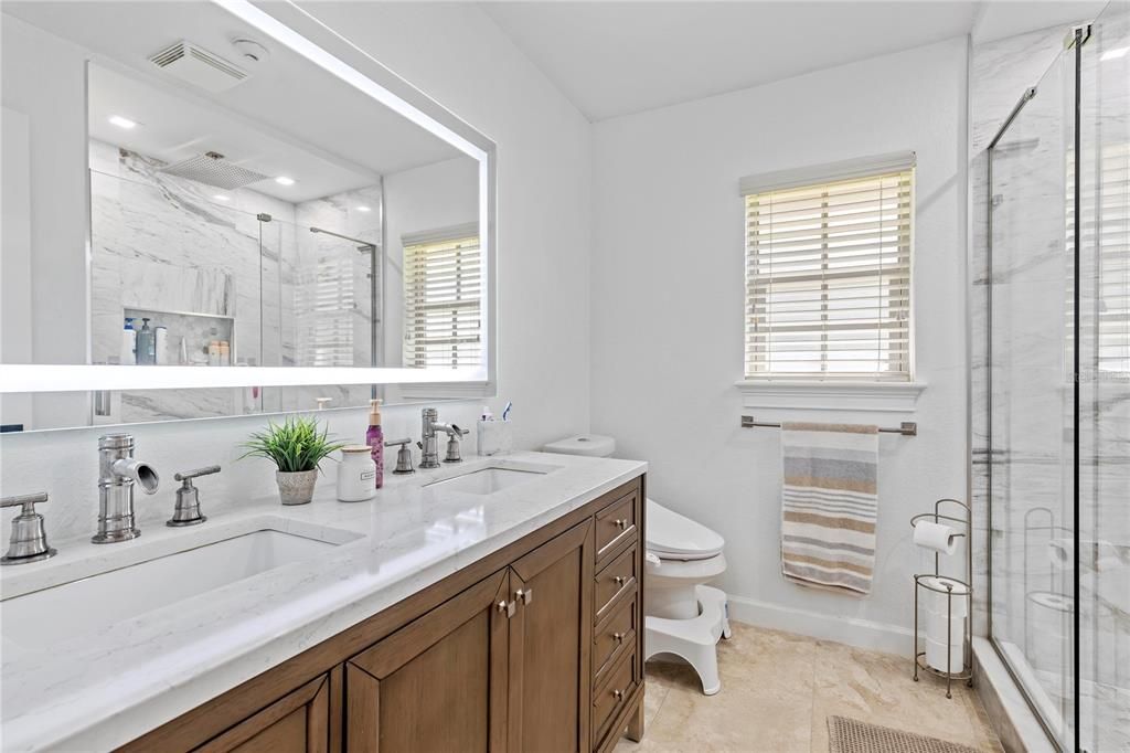 Bathroom, Dual Sink Vanities, Glass Shower, Interior, Marble Walls, Recessed Lighting