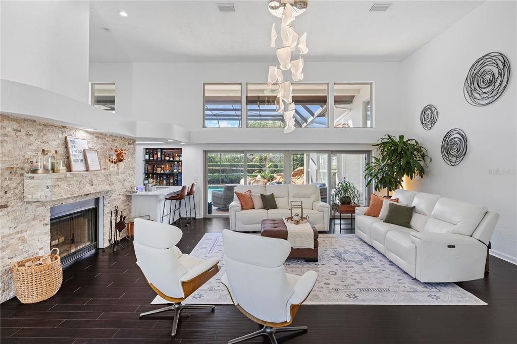 Fireplace, Interior, Living room, Pendant Lights, Recessed Lighting, Stone Walls, Wood Texture Flooring