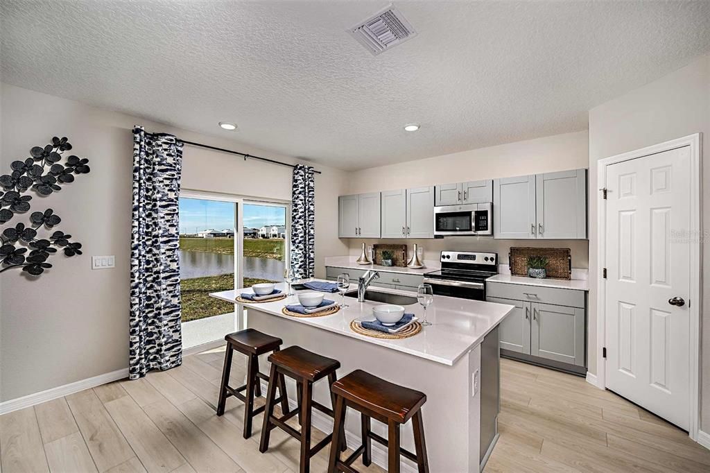 Interior, Kitchen, Recessed Lighting, Stainless Steel Appliances, Water, Wood Texture Flooring