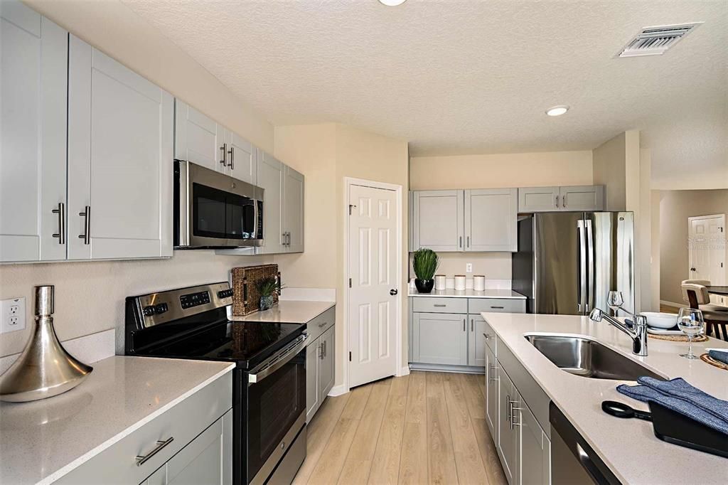 Interior, Kitchen, Recessed Lighting, Stainless Steel Appliances, Wood Texture Flooring