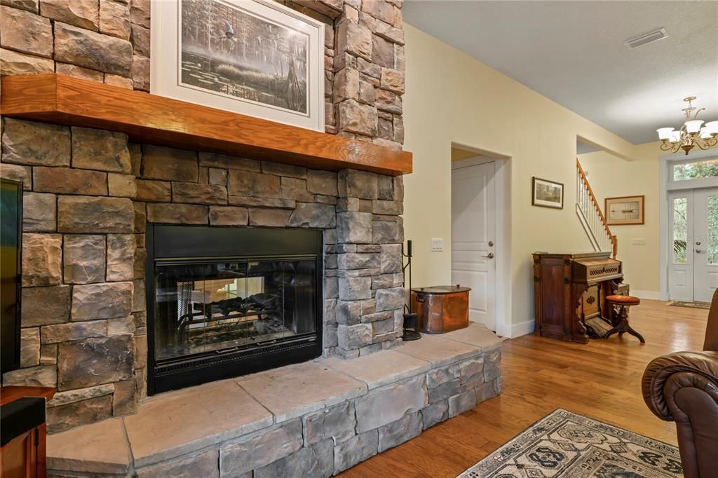 Chandelier, Fireplace, Interior, Piano, Stone Walls, Wood Texture Flooring