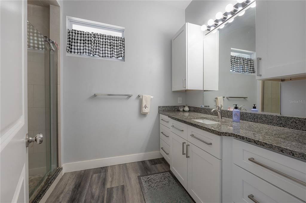 Bathroom, Dual Sink Vanities, Glass Shower, Interior, Wood Texture Flooring