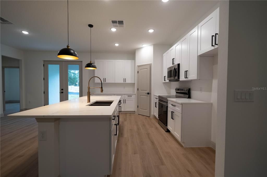 Interior, Kitchen, Pendant Lights, Recessed Lighting, Stainless Steel Appliances, Wood Texture Flooring
