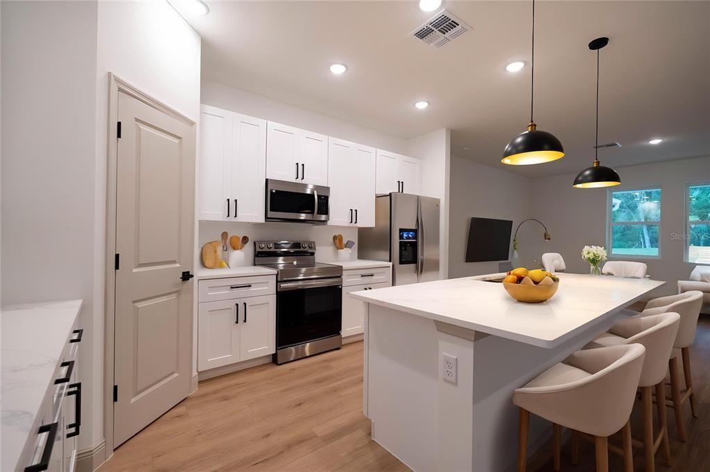 Interior, Kitchen, Pendant Lights, Recessed Lighting, Stainless Steel Appliances, Wood Texture Flooring