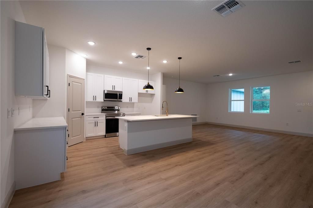 Interior, Kitchen, Pendant Lights, Recessed Lighting, Stainless Steel Appliances, Wood Texture Flooring