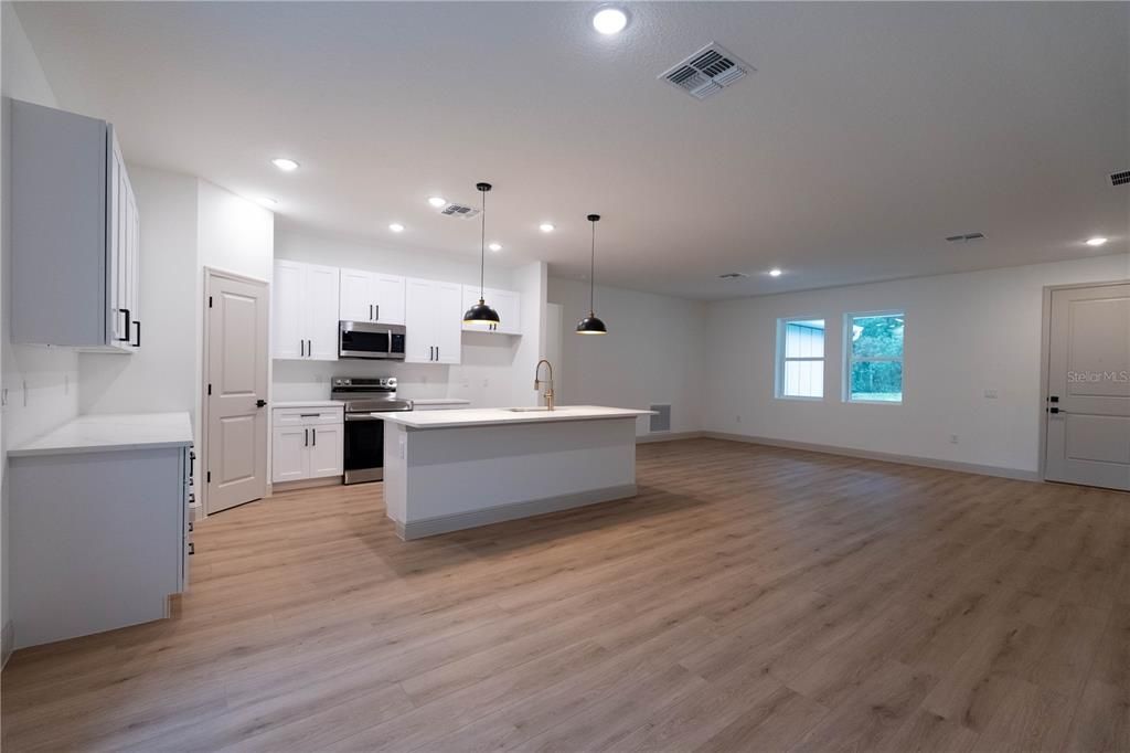 Interior, Kitchen, Pendant Lights, Recessed Lighting, Stainless Steel Appliances, Wood Texture Flooring