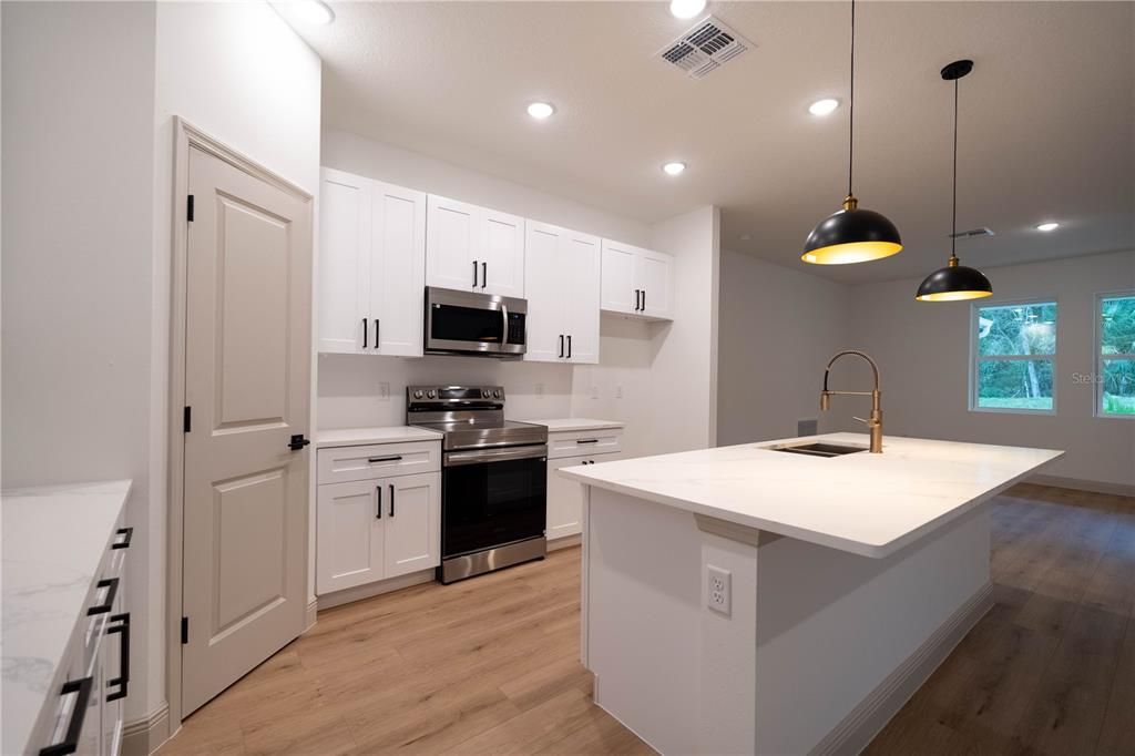 Interior, Kitchen, Pendant Lights, Recessed Lighting, Stainless Steel Appliances, Wood Texture Flooring