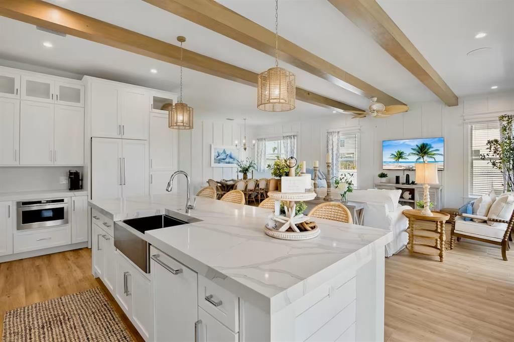 Dining room, Interior, Kitchen, Living room, Pendant Lights, Recessed Lighting, Stainless Steel Appliances, Wooden Beams, Wood Texture Flooring