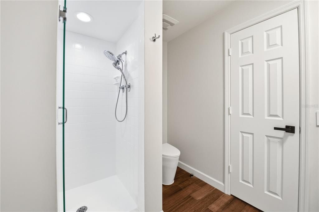 Bathroom, Glass Shower, Interior, Recessed Lighting, Wood Texture Flooring