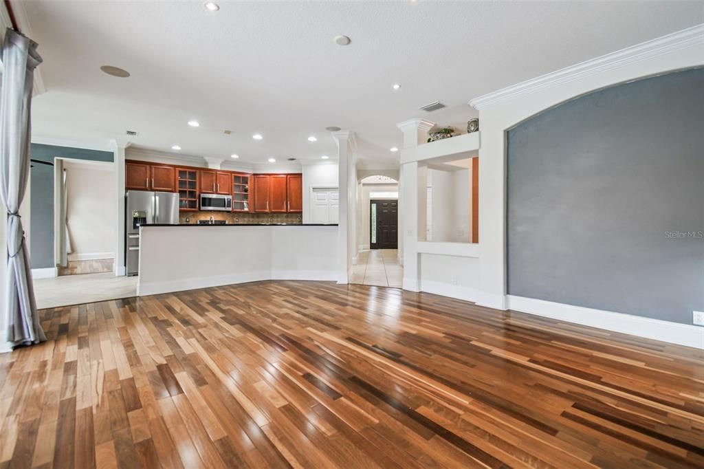 Empty room, Interior, Kitchen, Recessed Lighting, Stainless Steel Appliances, Wood Texture Flooring