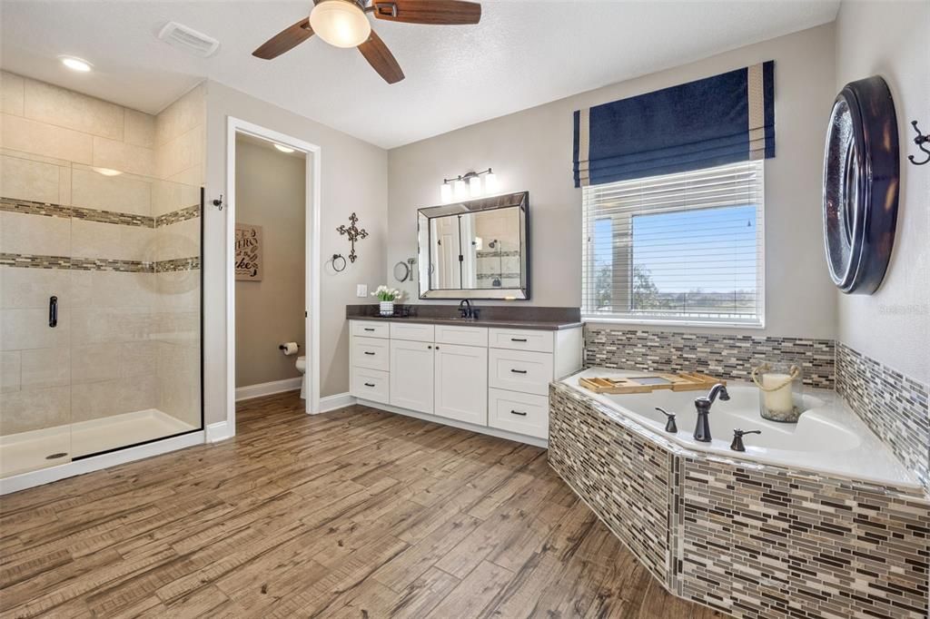Bathroom, Dual Sink Vanities, Glass Shower, Interior, Recessed Lighting, Wood Texture Flooring