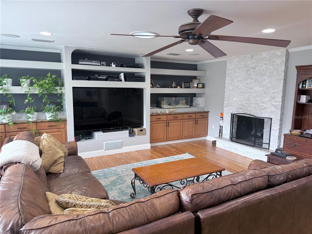 Fireplace, Interior, Living room, Recessed Lighting, Stone Walls, Wood Texture Flooring