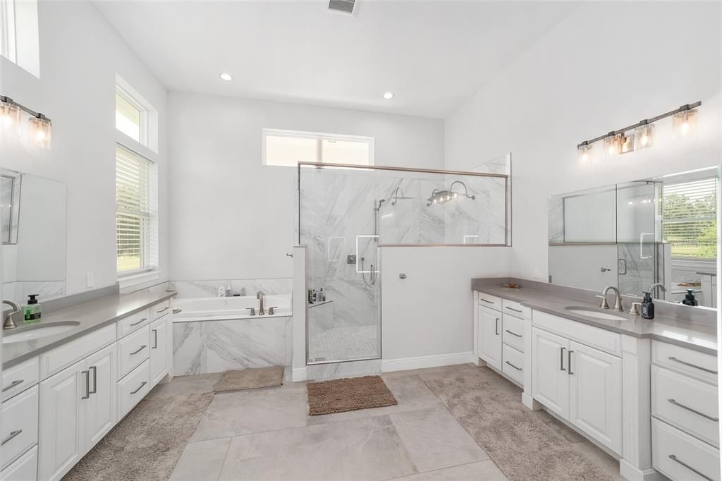 Bathroom, Dual Sink Vanities, Glass Shower, Interior, Marble Walls, Recessed Lighting